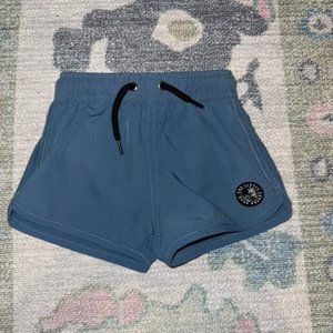 The Little Surfer Dude lined swim trunks 6-12m